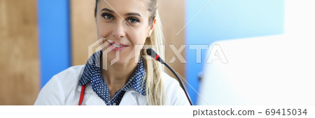 Female doctor with microphone on medical seminar portrait. 69415034