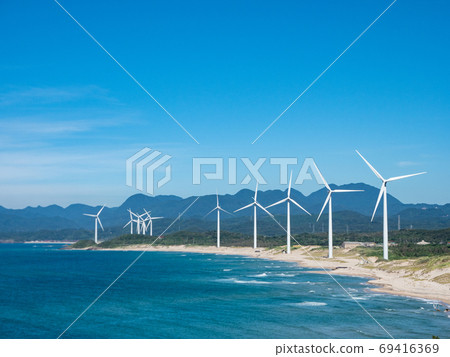 Wind power generator by the sea 69416369