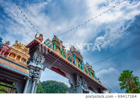 Statue of Lord Muragan and entrance at Batu Caves 69417164