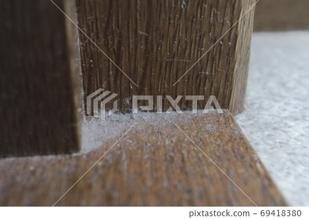 Dust collected in the corner of the room 69418380