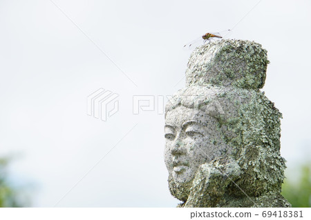 Gunma Prefecture Bentenyama summit stone statue and dragonfly 69418381