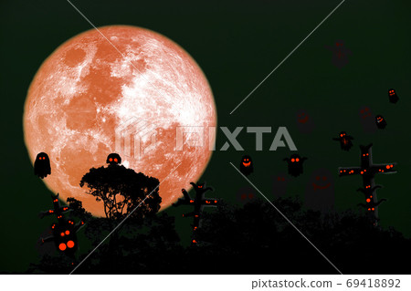 Full harvest blue moon and silhouette top tree on night sky Full harvest blue moon and silhouette top tree on night sky 69418892