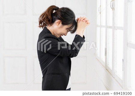Young business woman making a request gesture Young business woman making a request gesture 69419100