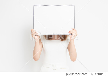 Young woman with ketch book 69420049
