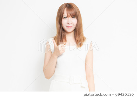 Young woman doing a like gesture Young woman doing a like gesture 69420150