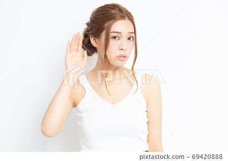 Young woman listening 69420888