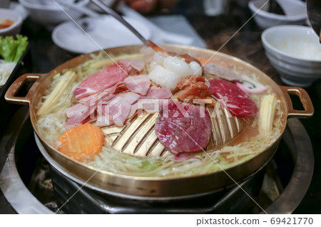 Pork, Shredded carrot, Shredded cabbage grill on BBQ brass pan, focus selective. Pork, Shredded carrot, Shredded cabbage grill on BBQ brass pan, focus selective. 69421770