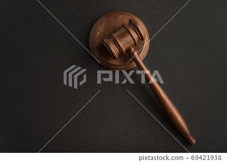 Judges gavel or hammer for auction on black background. Law justice and legal jurisprudence concept. 69421938