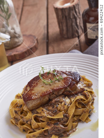 Grilled Foie gras steak with with Fettuccine pasta Grilled Foie gras steak with with Fettuccine pasta 69422412