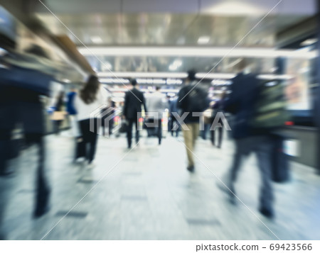 People walking Train station rush hour Blur background 69423566