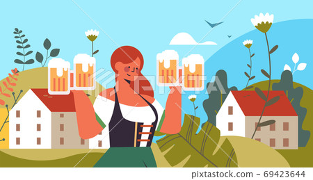 waitress holding beer mugs Oktoberfest party celebration concept 69423644