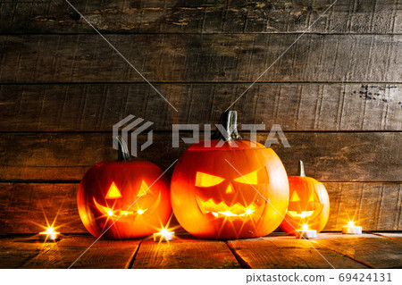Halloween pumpkins and candles Halloween pumpkins and candles 69424131