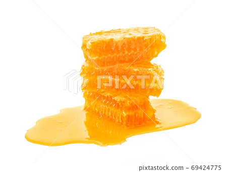 Honeycomb piece. Honey slice isolated on white background Honeycomb piece. Honey slice isolated on white background 69424775