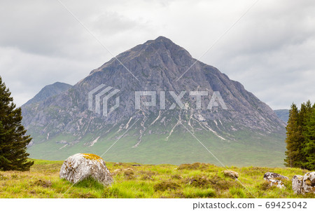 Buachaille Etive Mor. A view of Buachaille Etive Mor in the Scottish highlands. Buachaille Etive Mor is a mountain in the Scottish Highlands. Buachaille Etive Mor. A view of Buachaille Etive Mor in the Scottish highlands. Buachaille Etive Mor is a mountain in the Scottish Highlands. 69425042