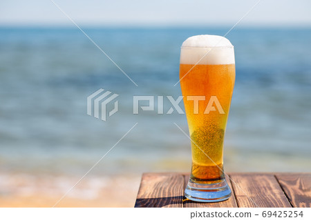 glass of beer with froth and bubbles glass of beer with froth and bubbles 69425254