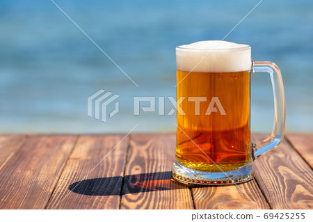 mug of beer with froth and bubbles mug of beer with froth and bubbles 69425255