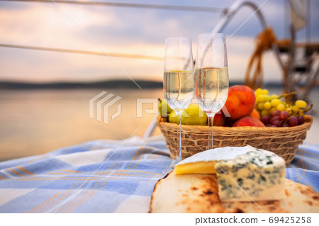 picnic on a yacht at sunset picnic on a yacht at sunset 69425258