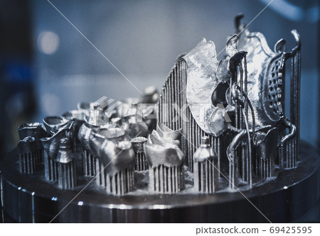 Object printed on metal 3d printer close-up. Object printed on metal 3d printer close-up. 69425595