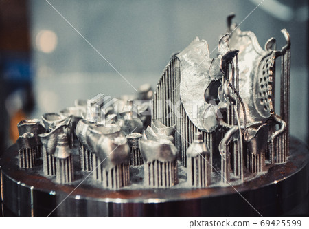 Object printed on metal 3d printer close-up. Object printed on metal 3d printer close-up. 69425599