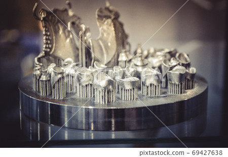 Object printed on metal 3d printer close-up. Object printed on metal 3d printer close-up. 69427638