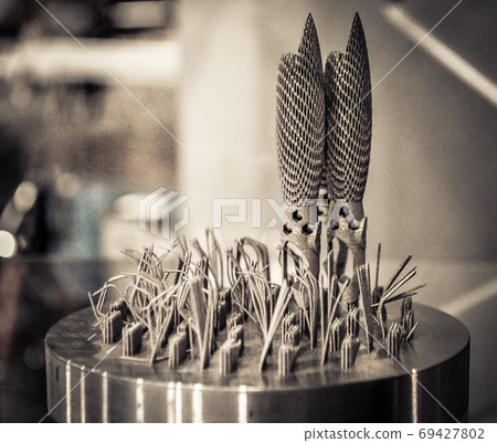 Object printed on metal 3d printer close-up. Object printed on metal 3d printer close-up. 69427802