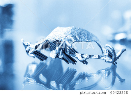 Object printed on metal 3d printer close-up. Object printed on metal 3d printer close-up. 69428238