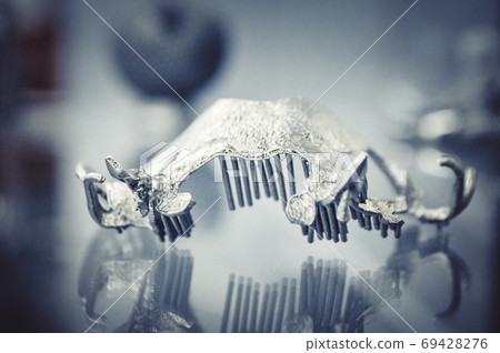 Object printed on metal 3d printer close-up. Object printed on metal 3d printer close-up. 69428276