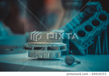 Man is holding object printed on metal 3d printer. 69428353