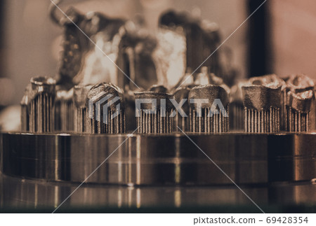 Object printed on metal 3d printer close-up 69428354