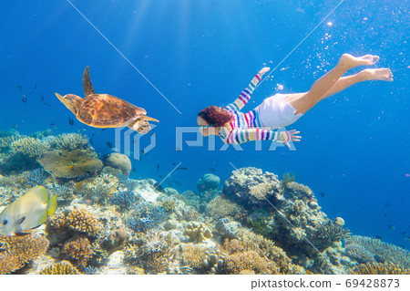 Child snorkeling. Kids underwater. Beach and sea. Child snorkeling. Kids underwater. Beach and sea. 69428873
