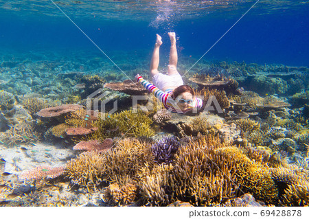 Child snorkeling. Kids underwater. Beach and sea. 69428878