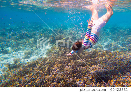 Child snorkeling. Kids underwater. Beach and sea. 69428881