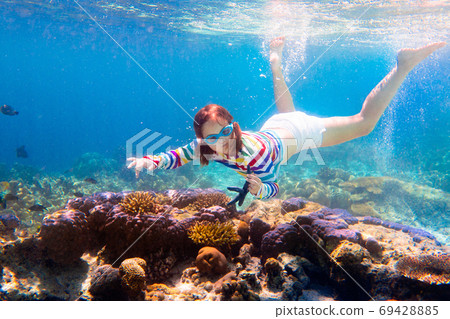 Child snorkeling. Kids underwater. Beach and sea. 69428885