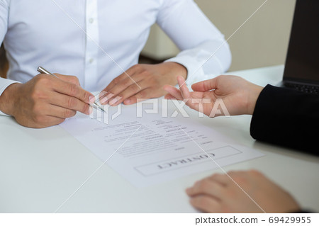 Managers or HR departments read resume and interview applicants for selection as a company real estate agent, Employment and selection of new staff representatives concept. Managers or HR departments read resume and interview applicants for selection as a company real estate agent, Employment and selection of new staff representatives concept. 69429955
