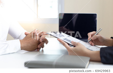 Managers or HR departments read resume and interview applicants for selection as a company real estate agent, Employment and selection of new staff representatives concept. Managers or HR departments read resume and interview applicants for selection as a company real estate agent, Employment and selection of new staff representatives concept. 69429963