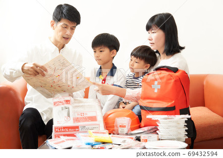 Family preparing disaster prevention goods 69432594