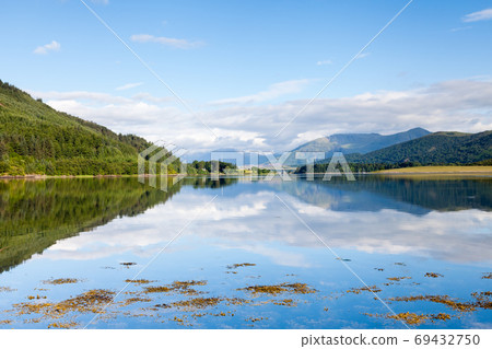 Loch Leven. The view across Loch Leven from Ballachulish towards Ballachulish Bridge in the Scottish highlands. Loch Leven is a sea loch on the west coast of Scotland. Loch Leven. The view across Loch Leven from Ballachulish towards Ballachulish Bridge in the Scottish highlands. Loch Leven is a sea loch on the west coast of Scotland. 69432750