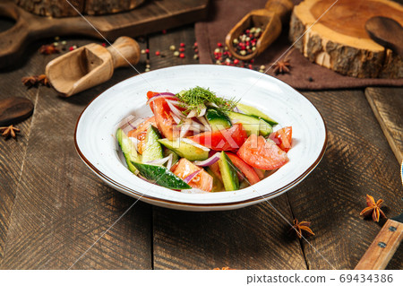 Fresh vegetables mix salad in a white plate 69434386
