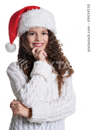 Portrait of smiling little girl in Santa hat 69434538
