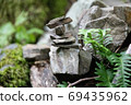 A stack of stones stands on top of each other. Mysterious ritual 69435962