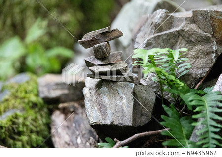 A stack of stones stands on top of each other. Mysterious ritual A stack of stones stands on top of each other. Mysterious ritual 69435962