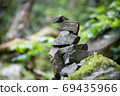 A stack of stones stands on top of each other. Mysterious ritual 69435966