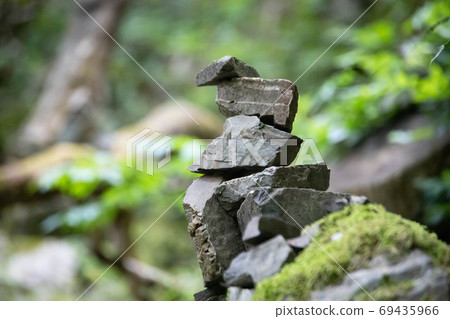 A stack of stones stands on top of each other. Mysterious ritual A stack of stones stands on top of each other. Mysterious ritual 69435966