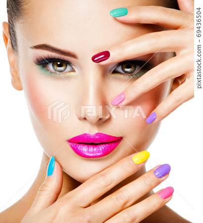 beautiful woman  with multicolor nails and fashion makeup 69436504