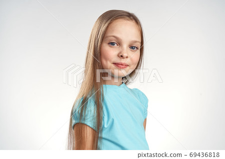 cute girl blue dresses cropped view light background emotions childhood fun 69436818