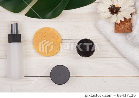 Wooden decorative background green leaf cosmetics for soap bathroom accessories Wooden decorative background green leaf cosmetics for soap bathroom accessories 69437120