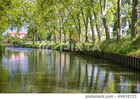 Summer look on Canal du Midi canal in Toulouse, southern Franc Summer look on Canal du Midi canal in Toulouse, southern Franc 69438725