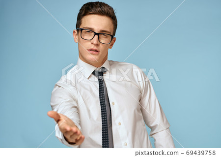 Business man white shirt tie glasses self-confidence official blue background 69439758