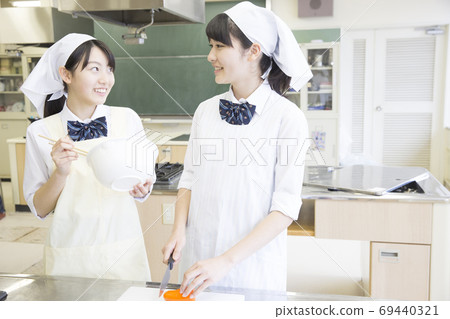 Students doing cooking training 69440321