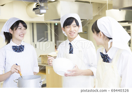 Students doing cooking training 69440326